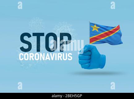 COVID-19 visuelles Konzept - Hand-Text Stop Coronavirus, Hand-Geste gegen Virusinfektion, geballte Faust hält Flagge der Demokratischen Republik der Stockfoto