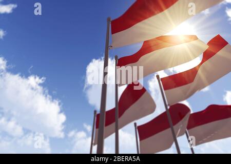 Indonesienflaggen winken im Wind gegen einen blauen Himmel. 3D-Rendering Stockfoto