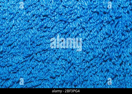 Blauer Textilhintergrund. Badetuch Nahaufnahme. Stoff Textur Stockfoto
