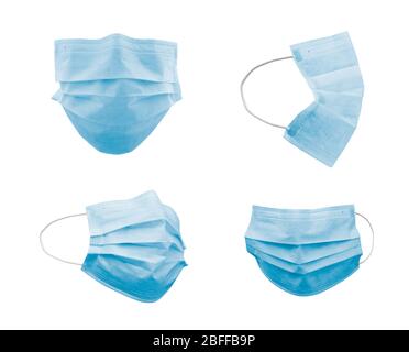 Sammlung von medizinischen Gesichtsmasken in verschiedenen Winkeln isoliert auf Weiß. Stockfoto