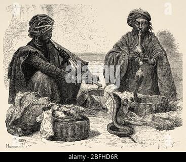 Porträt von Schlangenbeschwörern, Indien. Alte Gravurillustration aus El Mundo en la Mano 1878 Stockfoto