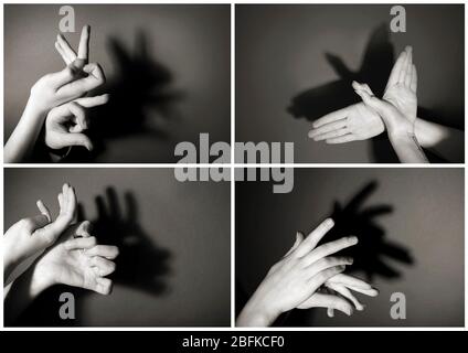 Hände Geste wie verschiedene Tiere und Figuren auf grauem Hintergrund Stockfoto