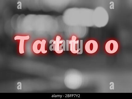 Text Tattoo auf verschwommenem Hintergrund Stockfoto