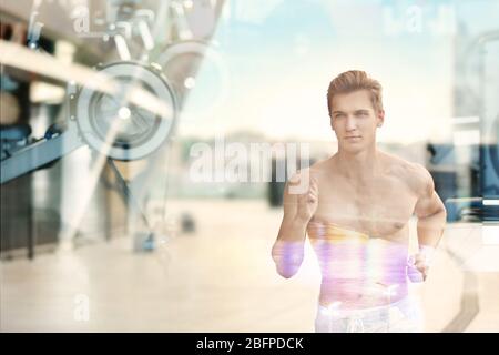 Doppelbelichtung von jungen sportlichen Mann und Stadt Hintergrund Stockfoto