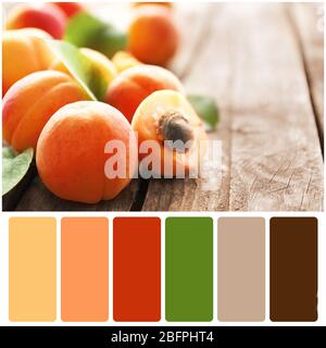 Farbanpassung. Leckere Aprikosen auf Holzhintergrund Stockfoto