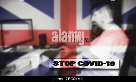 STOP COVID-19, ein Held sein, zu Hause bleiben. Im Hintergrund eine britische Flagge und ein Mann in seinem Haus, ein verschwommenes Bild. Stockfoto