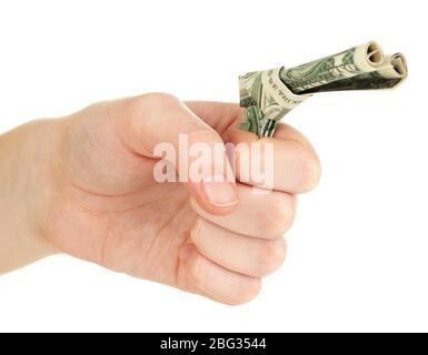 Dollar gefaltet in Waffe in der Hand isoliert auf weiß Stockfoto