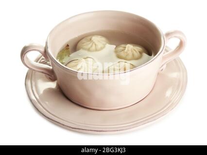 Schmackhafte khinkali in Topf, isoliert auf weiß Stockfoto