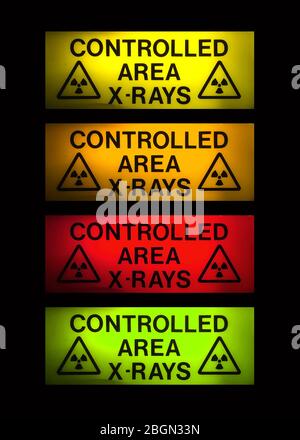 Röntgenstrahlen Zeichen in 4 verschiedenen Farben auf schwarz Stockfoto