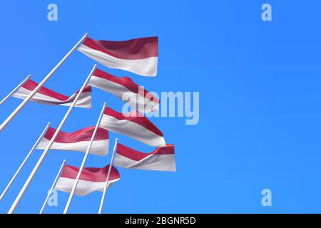 Indonesienflaggen winken im Wind gegen einen blauen Himmel. 3D-Rendering Stockfoto