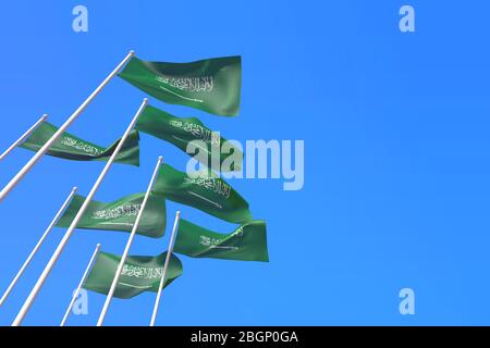 Saudi-Arabien Fahnen winken im Wind gegen einen blauen Himmel. 3D-Rendering Stockfoto