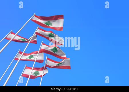 Libanonfahnen winken im Wind gegen einen blauen Himmel. 3D-Rendering Stockfoto