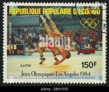 KONGO - UM 1984: Briefmarke gedruckt von Kongo, zeigt 1984 Olympische Sommerspiele, Los Angeles. Ringen, um 1984. Stockfoto