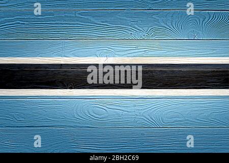 Botswana Flagge auf alten Holzplanke Hintergrund gemalt. Gebürstete natürliche leichte geknotete Holzbrett Textur. Holzstruktur Hintergrundflagge von Botswana. Stockfoto