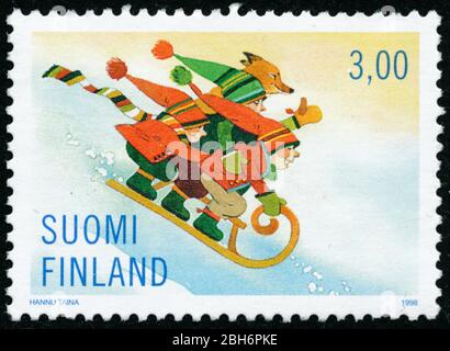 POLTAVA, UKRAINE - 24. April 2020. Vintage Stempel gedruckt in Finnland um 1998 zeigen Weihnachten Stockfoto