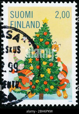 POLTAVA, UKRAINE - 24. April 2020. Vintage Stempel gedruckt in Finnland um 1998 zeigen Weihnachten Stockfoto