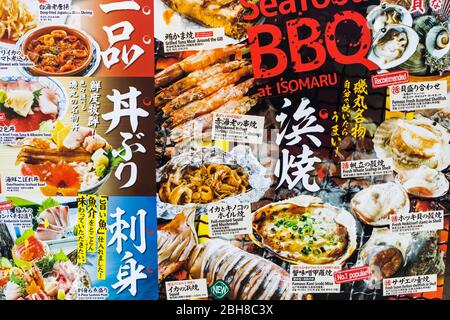 Japan, Honshu, Tokio, Seafood Restaurant, zweisprachige Menü Fenster Stockfoto