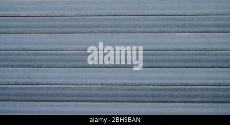Grau Wellblech Textur blau rostig Stahl Tür Metall Hintergrund grau Stockfoto