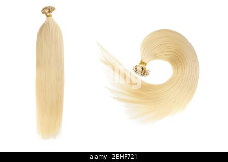 Set von zwei gefälschten Frauen Haarverlängerungen in Schwänzen, isoliert auf weißem Hintergrund. Hellblond oder goldfarben. Stockfoto