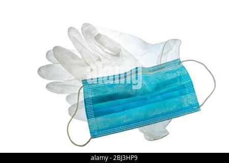 Transparente Einweg-Kunststoffhandschuhe und Gesichtsmaske/Gesichtsmaske zur Verhinderung der Ausbreitung von Keimen während der COVID-19 / Coronavirus / Corona-Virus-Pandemie Stockfoto