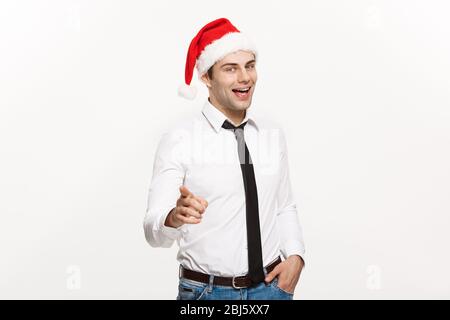 Christmas Concept - Handsome Business man tragen santa Hut Zeigen Finger auf weißen isolierten Hintergrund. Stockfoto