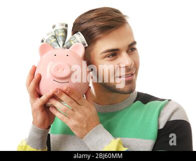 Mann mit Geldbox und Banknoten darin isoliert auf weiß Stockfoto