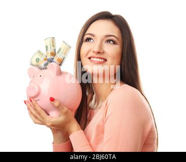 Frau mit Geldbox und Banknoten darin isoliert auf weiß Stockfoto