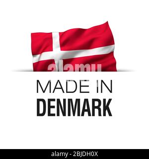 Made in Denmark - Garantie-Etikett mit einer winkenden dänischen Flagge. Stockfoto