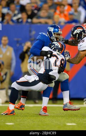 15. September 2013: New York Giants Defensive Tackle Linval Joseph (97) greift Denver Broncos zurücklaufen Montee Ball (28) in der zweiten Hälfte des Stockfoto