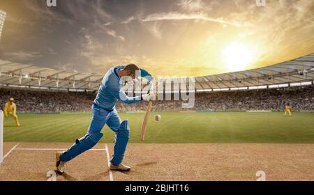 Batsman verteidigt einen Ball während eines Spiels im Stadion Stockfoto