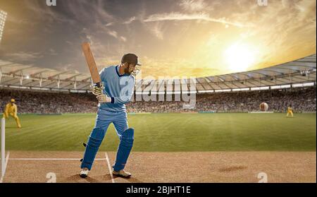 Batsman verteidigt einen Ball während eines Spiels im Stadion Stockfoto