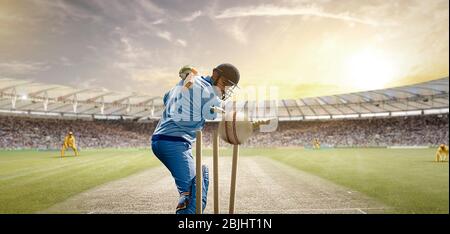 Rückansicht des Cricket Ball, der hinter dem Batsman die Stolps trifft Stockfoto