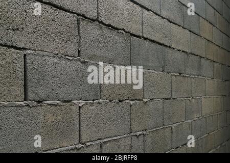 Wand aus grauem Schlacke Block Ziegel in Perspektive Stockfoto