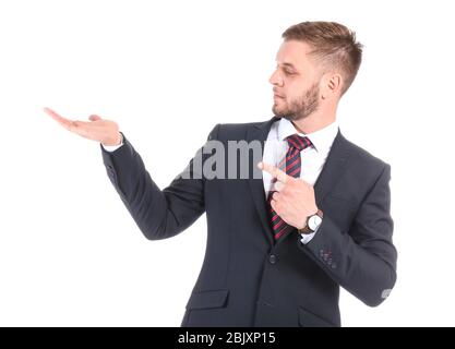 Gut aussehender Geschäftsmann Holding etwas auf weißem Hintergrund Stockfoto