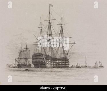 HMS Victory im Hafen von Portsmouth mit einem Kohleschiff neben 1828. Stockfoto