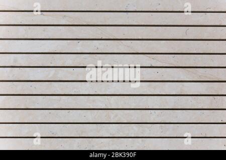 Hellbeige gestreifte Marmorwand Stockfoto