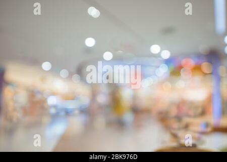 Abstrakt Bokeh und verschwimmen schönen Luxus-Einkaufszentrum und Einzelhandel speichern Interieur für Hintergrund. Geschäftlicher Hintergrund. Stockfoto