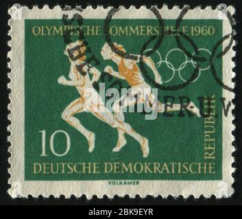 DEUTSCHLAND - UM 1959: Briefmarke gedruckt von Deutschland, zeigt Sprinter, um 1959 Stockfoto