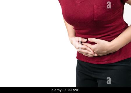 Magenschmerzen, junge Frau, die an Bauchschmerzen Gefühl Symptom von pms auf weißem Hintergrund Stockfoto