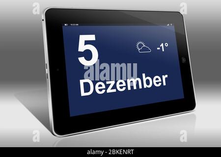 Ein Tablet-Computer zeigt einen Kalender in deutscher Sprache mit dem Datum 5. Dezember an. Ein Tablet-Computer zeigt das Datum 5. Dezember Stockfoto