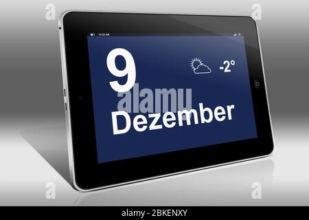 Ein Tablet-Computer zeigt einen Kalender in deutscher Sprache mit dem Datum 9. Dezember an. Dezember Stockfoto