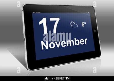 Ein Tablet-Computer zeigt einen Kalender in deutscher Sprache mit dem Datum 17. November an. Ein Tablet-Computer zeigt das Datum 17. November Stockfoto