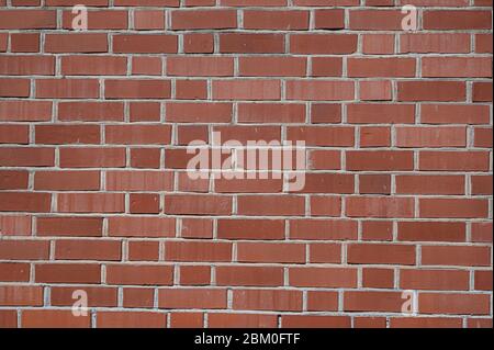 Rot, orange Backstein-Wandstruktur, Hintergrund. Stockfoto