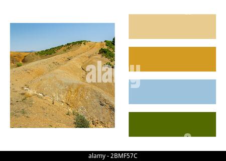 Albanische Naturlandschaft. Sandige Hügel mit Regenwasser-Schild auf dem Boden in einer Farbpalette, mit kostenlosen Farbfeldern Stockfoto