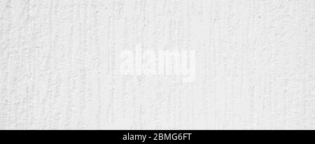 Weiße Wand mit kleinen Kratzern. Detailreiche Wandstruktur Nahaufnahme. Stockfoto