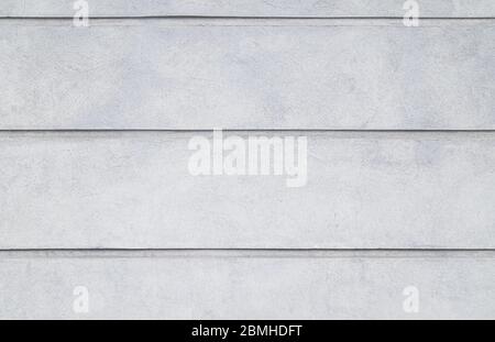 Vorderansicht einer verputzten grauen Steinmauer. Abstrakter hochauflösender Vollformat-Hintergrund mit Struktur. Stockfoto