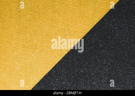 Schwarz und gelb Stoff Textur. Gestrickte Textil Nahaufnahme. Gewebte Hintergrund Makro Stockfoto