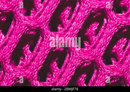 Rosa Stoff Textur Makro. Abstraktes Strickmuster. Gewebe. Textil Hintergrund Stockfoto