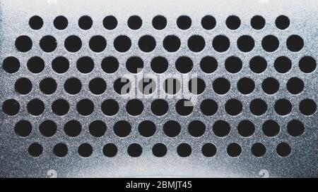 Runde Löcher in Kunststoffplatte. Rastermuster. Abstrakter Hintergrund Stockfoto