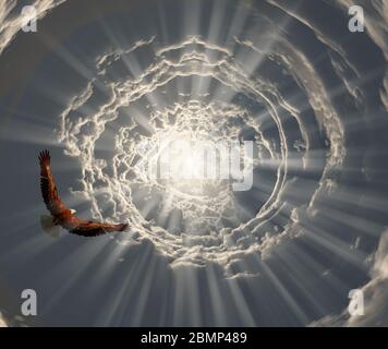 Surrealismus. Adler fliegt im Tunnel der Wolken zum Licht Stockfoto